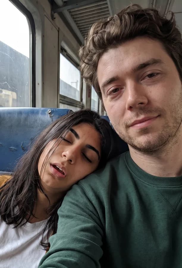 She has fallen asleep on his shoulder on the train to Alexandria